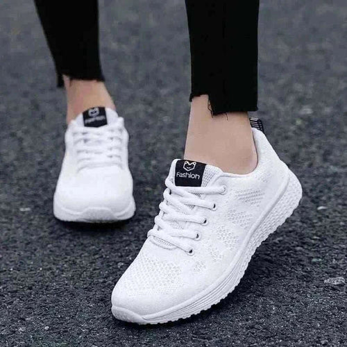 Women in White Sneakers 